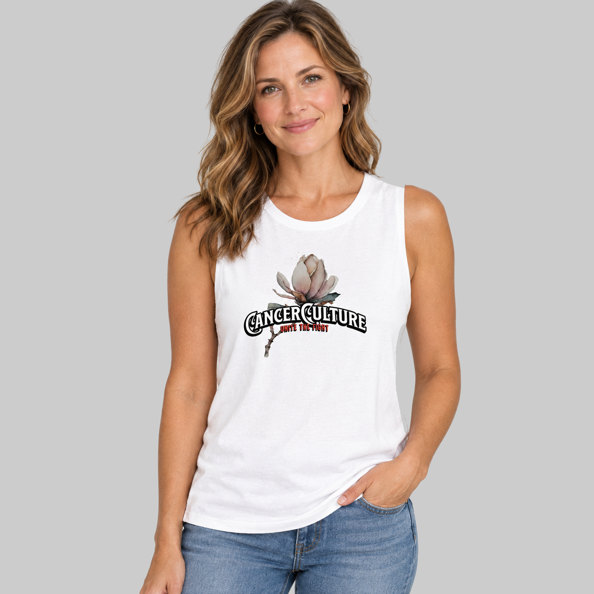 CancerCulture® Bloom Ladies' Muscle Tank, White, front, CancerCulture magnolia, Unite the Fight print, worn by woman, studio gray background