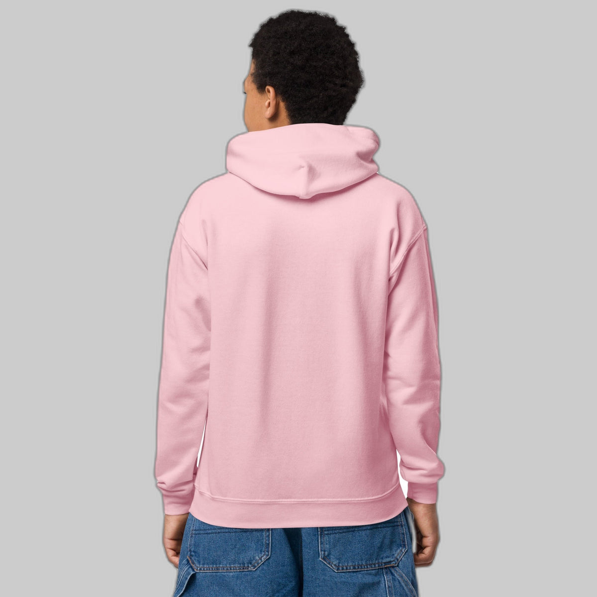 Powered by Courage youth pullover hoodie in Light Pink, back view (plain back, print is on the front). Childhood cancer gold ribbon kids apparel from CancerCulture®